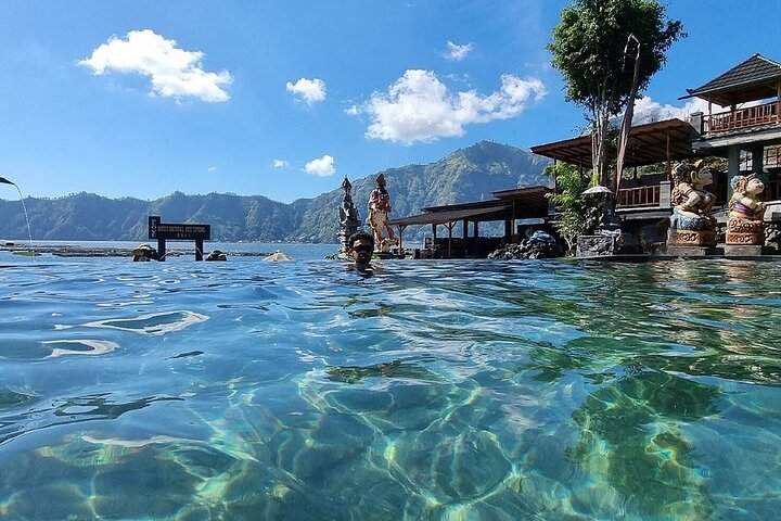 Relaxing hot spring pool overlooking Lake Batur