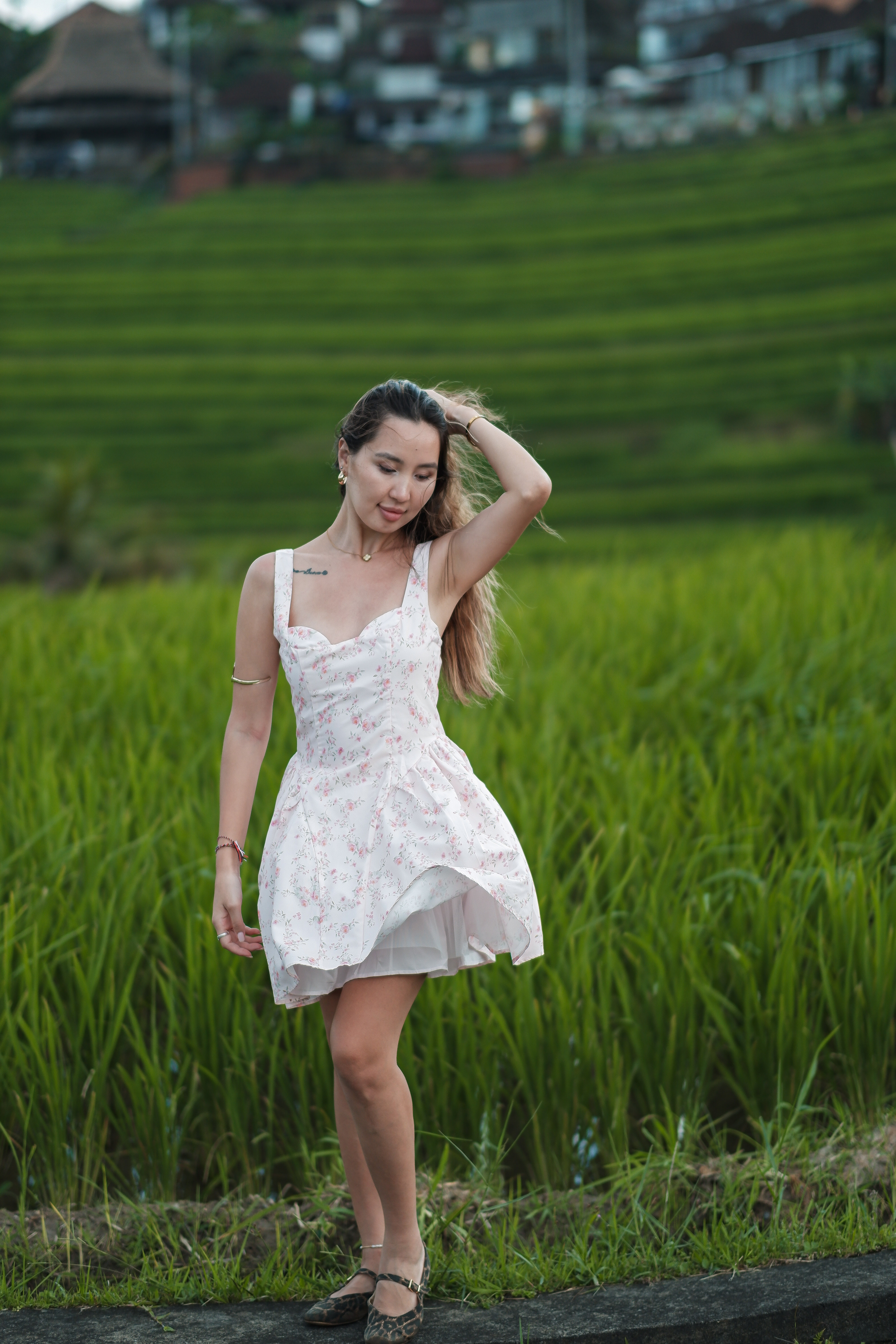 Traveller posing in white dress at Jatiluwih rice terraces