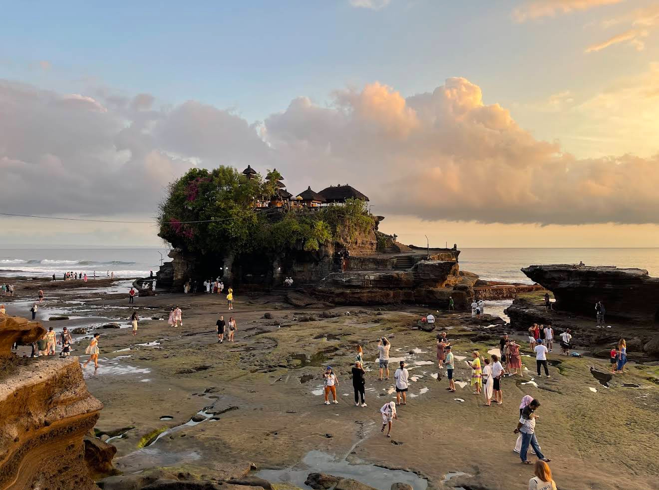 Wide-angle view of the Tanah Lot coastline at twilight