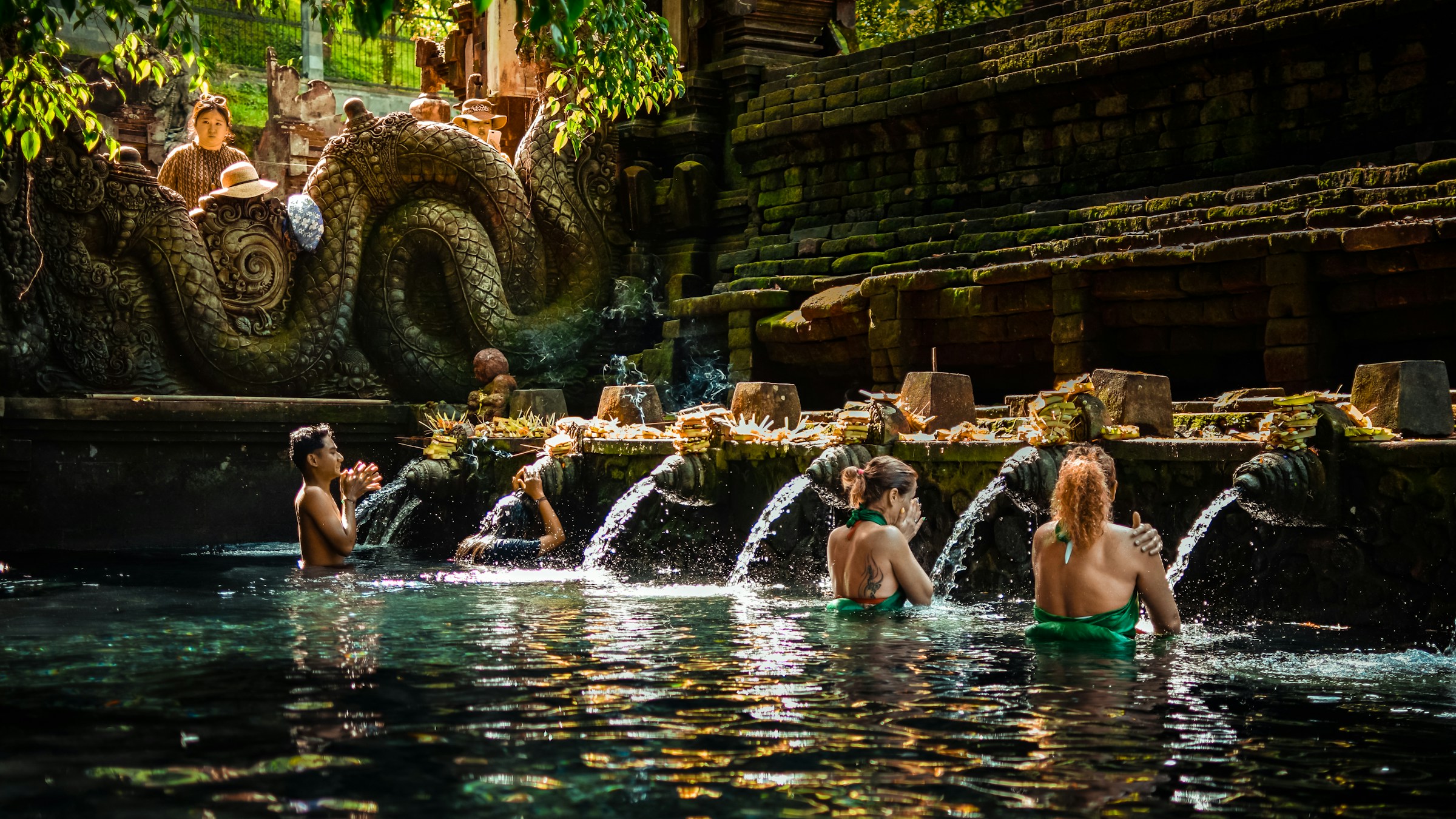 Tirta Empul holy spring with bathing pavilions and koi pond