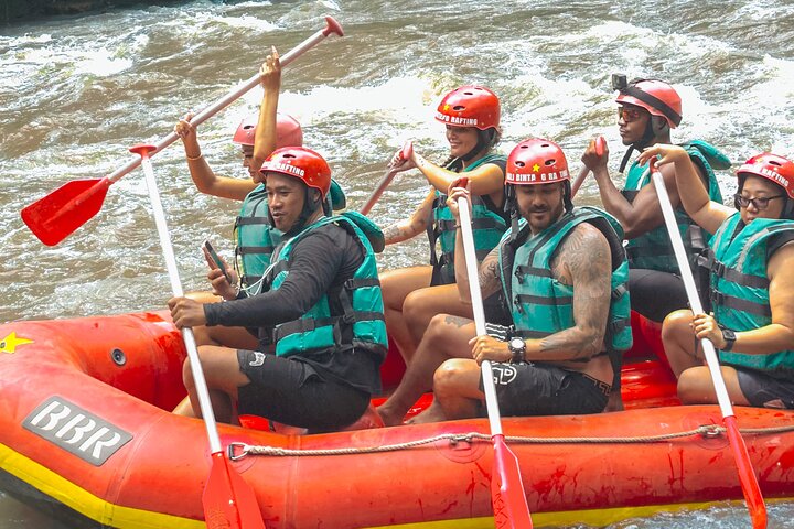 White water rafting team navigating Ayung River rapids