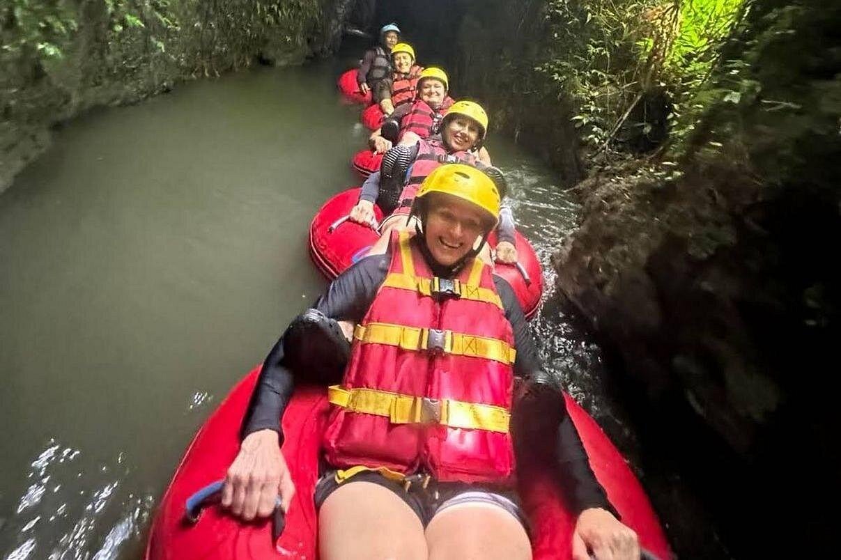 River tubing line winding through narrow jungle canyon