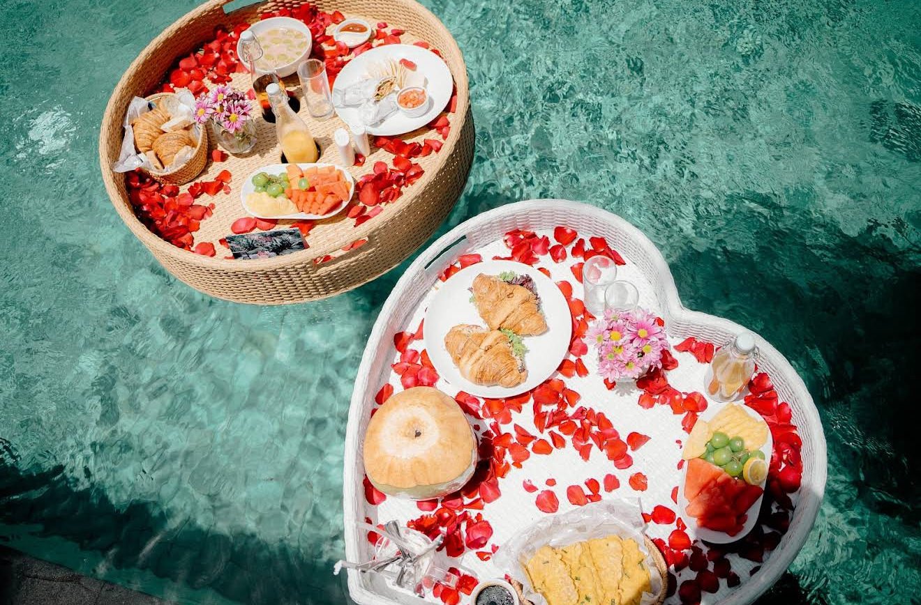 River-jungle floating breakfast platter served on a tropical pool